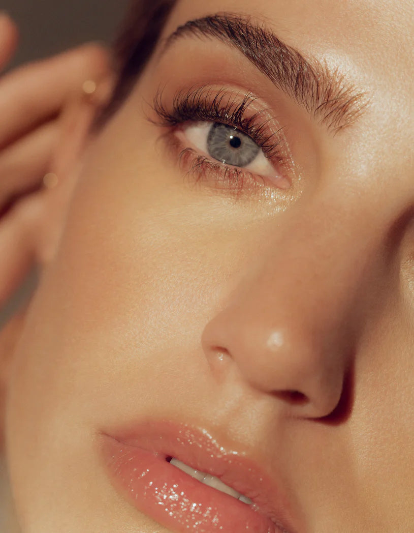 model with thick brows looking straight